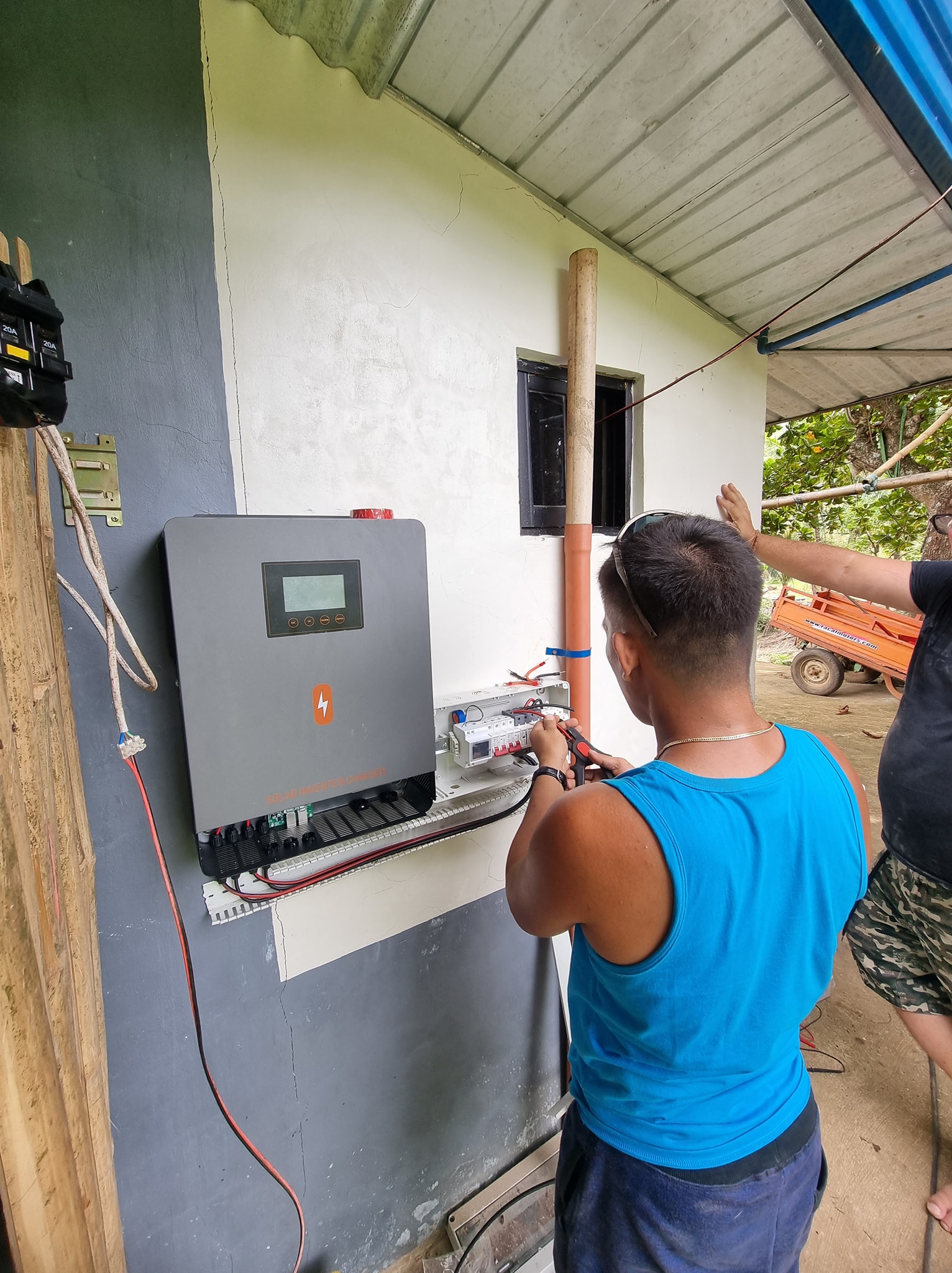 JDL Wireless technician configuring solar inverter system